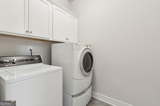5726 Taylor Way, Sandy Springs, GA 30342 - washroom with washer and dryer and cabinet space