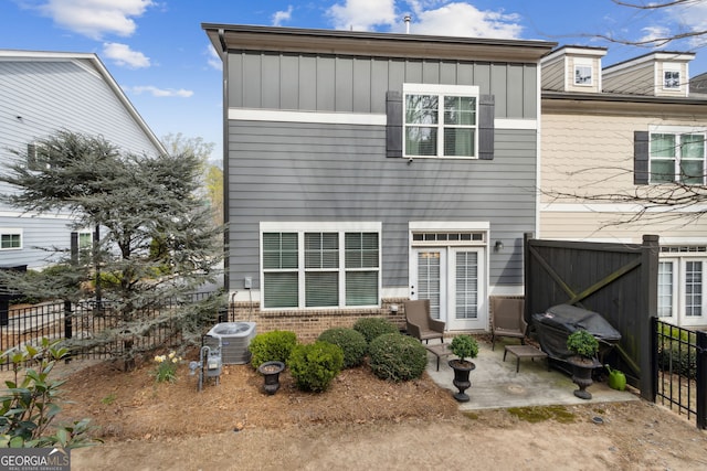 5726 Taylor Way, Sandy Springs, GA 30342 - back of property featuring a patio area, board and batten siding, and brick siding
