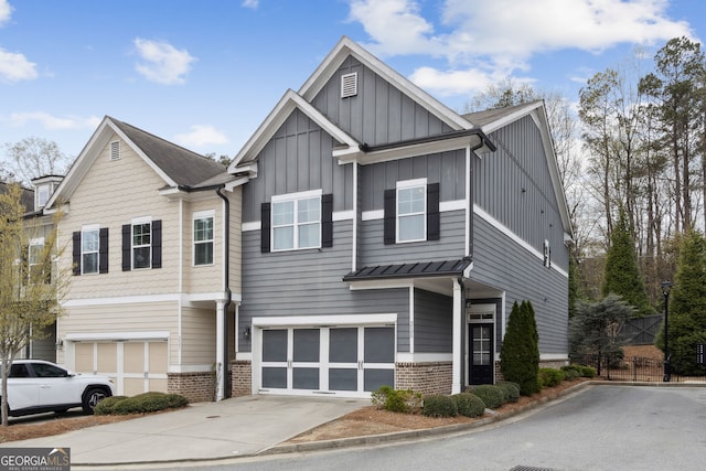 5726 Taylor Way, Sandy Springs, GA 30342 - view of front of property with brick siding, driveway, board and batten siding, and an attached garage