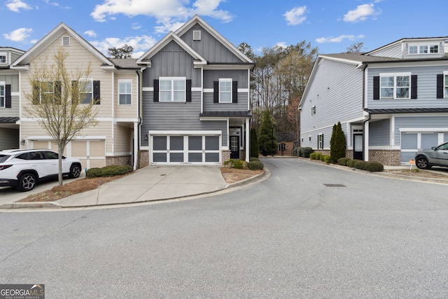 5726 Taylor Way, Sandy Springs, GA 30342 - view of front of home with concrete driveway, board and batten siding, an attached garage, and brick siding