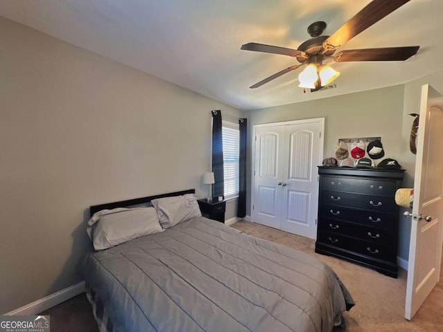 bedroom with ceiling fan and carpet floors