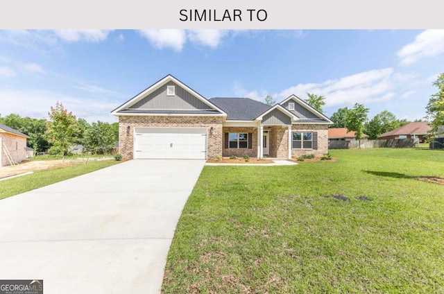 107 Tilden Way, Perry, GA 31069 - craftsman house with a front lawn, driveway, a garage, and brick siding