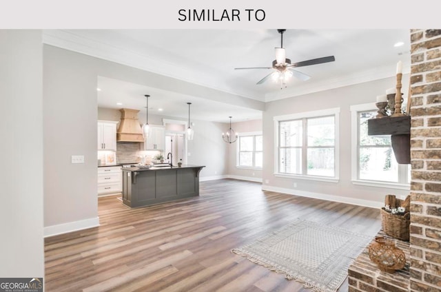 107 Tilden Way, Perry, GA 31069 - unfurnished living room with ornamental molding, baseboards, wood finished floors, a ceiling fan, and recessed lighting