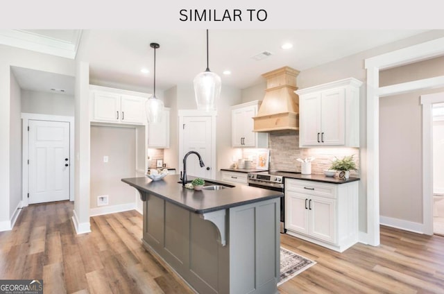 107 Tilden Way, Perry, GA 31069 - kitchen featuring dark countertops, stainless steel electric range, premium range hood, backsplash, and white cabinetry