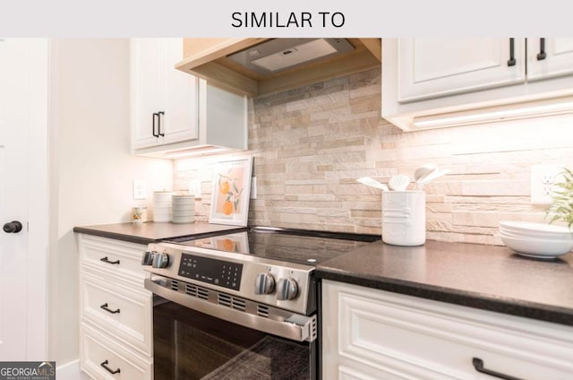 107 Tilden Way, Perry, GA 31069 - kitchen with stainless steel electric range oven, dark countertops, backsplash, and white cabinetry