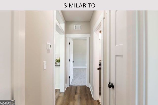 107 Tilden Way, Perry, GA 31069 - hallway featuring dark wood finished floors and baseboards