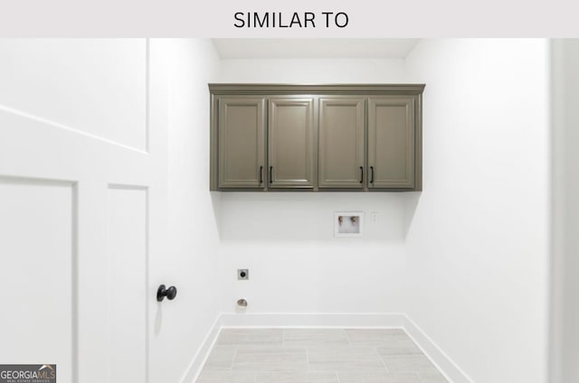 107 Tilden Way, Perry, GA 31069 - washroom featuring washer hookup, electric dryer hookup, and cabinet space