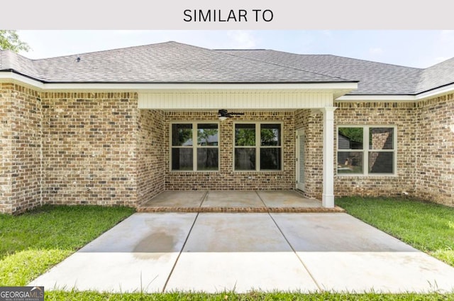 107 Tilden Way, Perry, GA 31069 - back of property with a patio, a shingled roof, brick siding, and a ceiling fan