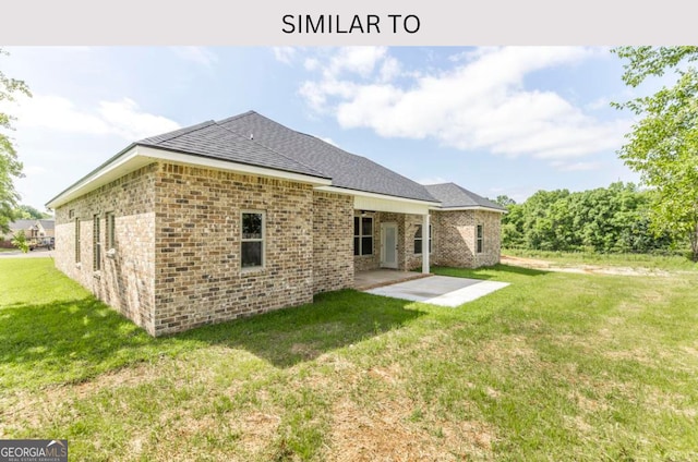 107 Tilden Way, Perry, GA 31069 - rear view of property with a yard, a patio, a shingled roof, and brick siding