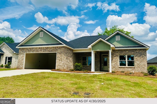 107 Tilden Way, Perry, GA 31069 - view of front of home with concrete driveway, brick siding, a front lawn, and a garage