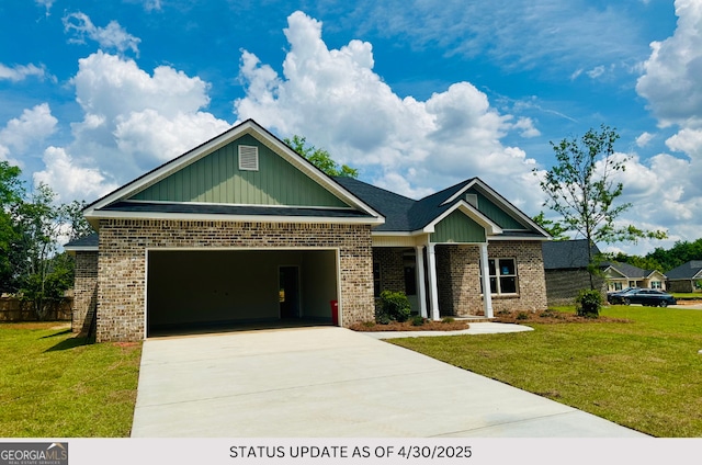 107 Tilden Way, Perry, GA 31069 - view of front of home featuring brick siding, driveway, an attached garage, and a front lawn