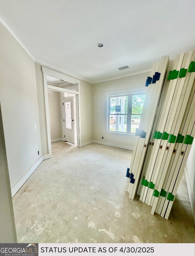 107 Tilden Way, Perry, GA 31069 - spare room featuring concrete floors, baseboards, and ornamental molding