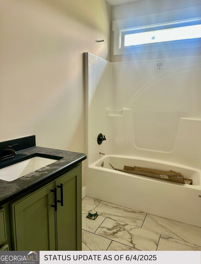 107 Tilden Way, Perry, GA 31069 - bathroom featuring marble finish flooring, vanity, and bathtub / shower combination