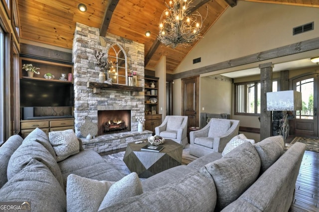 living room featuring high vaulted ceiling, visible vents, hardwood / wood-style flooring, a fireplace, and beam ceiling