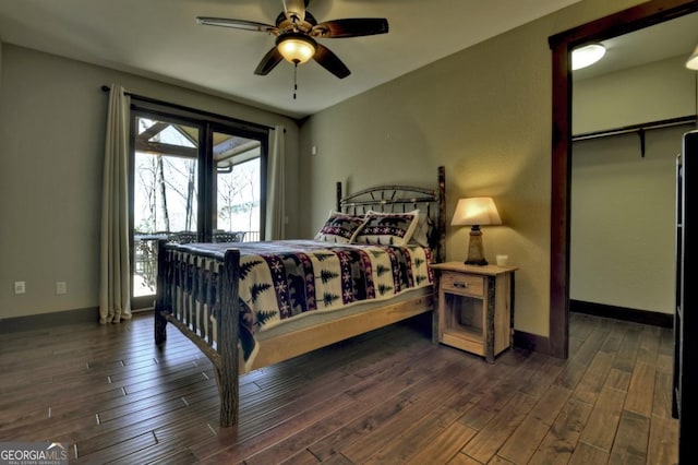 bedroom with dark wood-style floors, baseboards, and ceiling fan