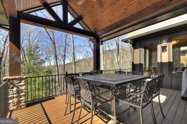 deck featuring a ceiling fan and outdoor dining space