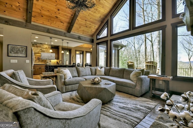 living room with wooden ceiling, high vaulted ceiling, wood finished floors, and beamed ceiling