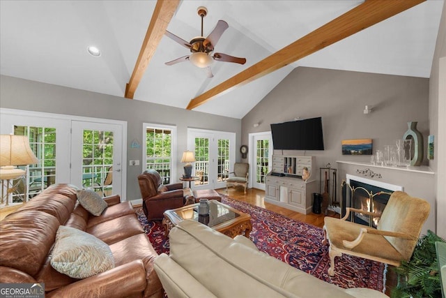 living room with wood finished floors, beam ceiling, ceiling fan, high vaulted ceiling, and recessed lighting