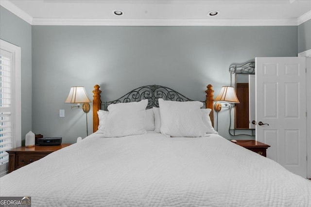 bedroom with crown molding and recessed lighting