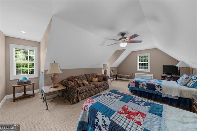 carpeted bedroom with baseboards, multiple windows, a ceiling fan, and lofted ceiling