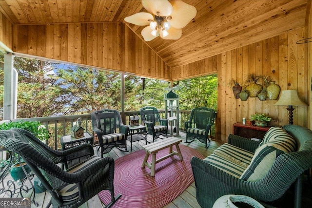 sunroom with ceiling fan and outdoor lounge area