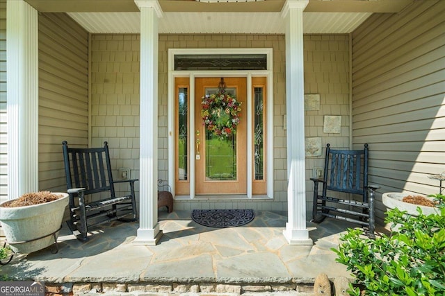 property entrance with covered porch