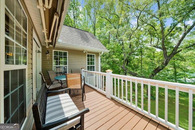 deck with outdoor dining area