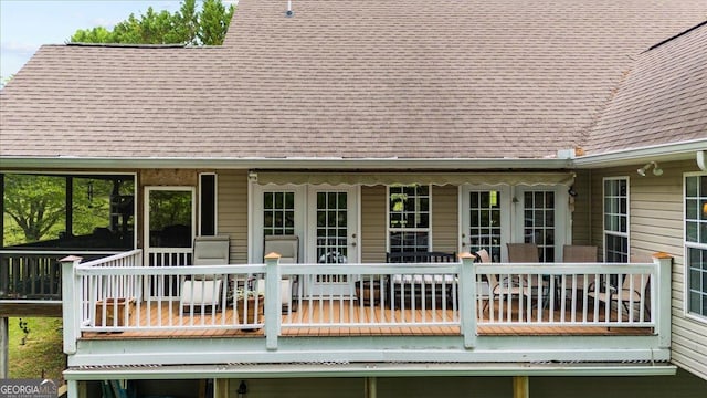 wooden deck featuring french doors