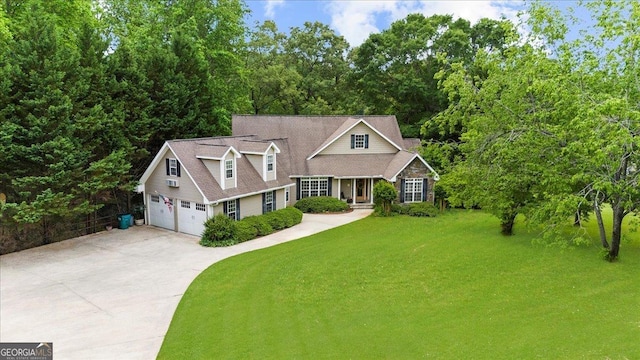 view of front of house with an attached garage, a front yard, and concrete driveway