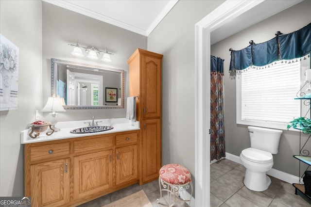 bathroom featuring a healthy amount of sunlight, crown molding, tile patterned flooring, vanity, and toilet