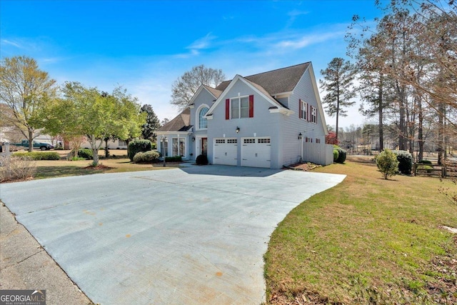 2445 Ridgelake Dr, Villa Rica, GA 30180 - view of front facade with an attached garage, concrete driveway, and a front yard