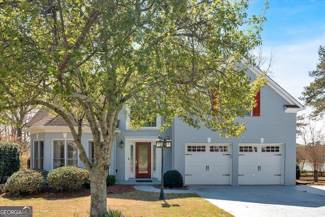 2445 Ridgelake Dr, Villa Rica, GA 30180 - obstructed view of property with brick siding, an attached garage, and driveway