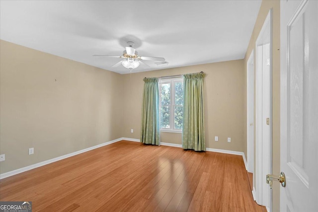 2445 Ridgelake Dr, Villa Rica, GA 30180 - empty room featuring light wood-style floors and a ceiling fan