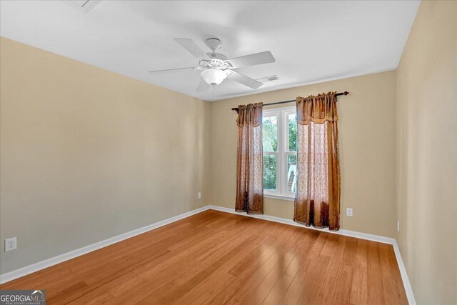 2445 Ridgelake Dr, Villa Rica, GA 30180 - empty room featuring light wood-type flooring and a ceiling fan