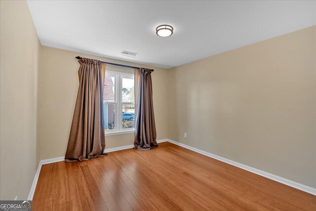 2445 Ridgelake Dr, Villa Rica, GA 30180 - spare room featuring light wood-style floors and baseboards