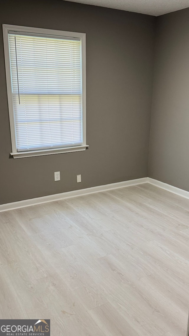 1655 Cherry Hill Rd SW, Conyers, GA 30094 - empty room with baseboards and wood finished floors