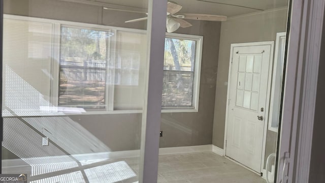 1655 Cherry Hill Rd SW, Conyers, GA 30094 - entryway with ceiling fan, baseboards, and ornamental molding