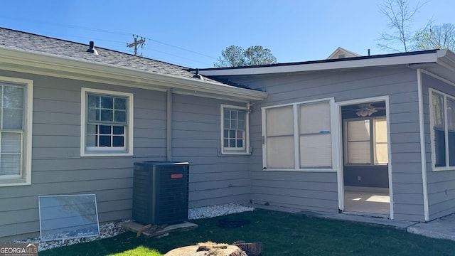 1655 Cherry Hill Rd SW, Conyers, GA 30094 - view of side of property featuring a lawn and central AC unit