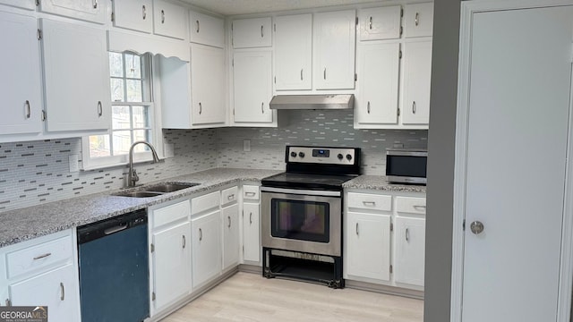 1655 Cherry Hill Rd SW, Conyers, GA 30094 - kitchen featuring tasteful backsplash, a sink, appliances with stainless steel finishes, white cabinetry, and under cabinet range hood