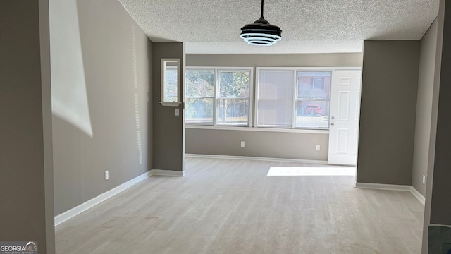 1655 Cherry Hill Rd SW, Conyers, GA 30094 - interior space with light wood-style floors, a textured ceiling, and baseboards