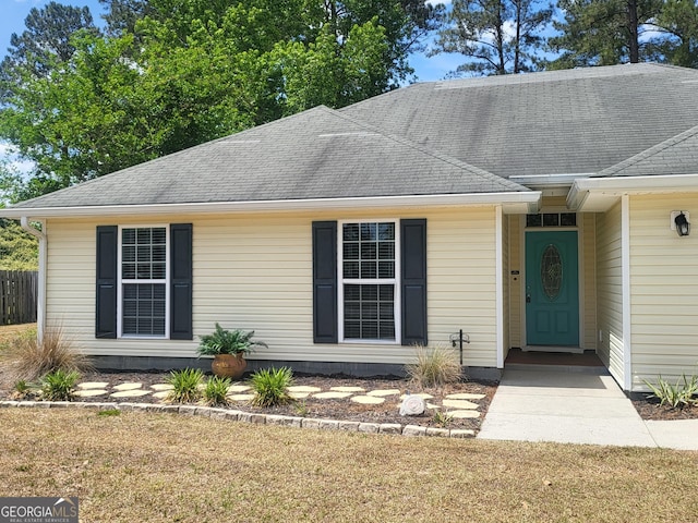 view of front of property featuring roof with shingles