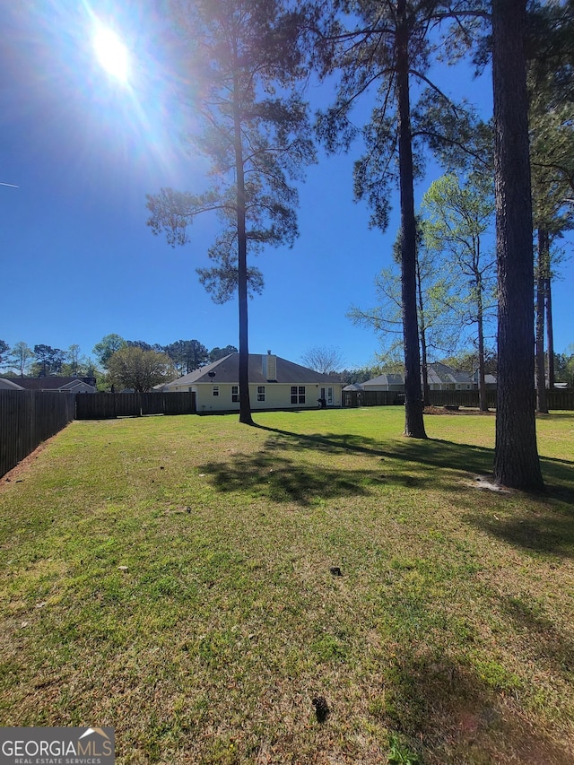 view of yard featuring fence