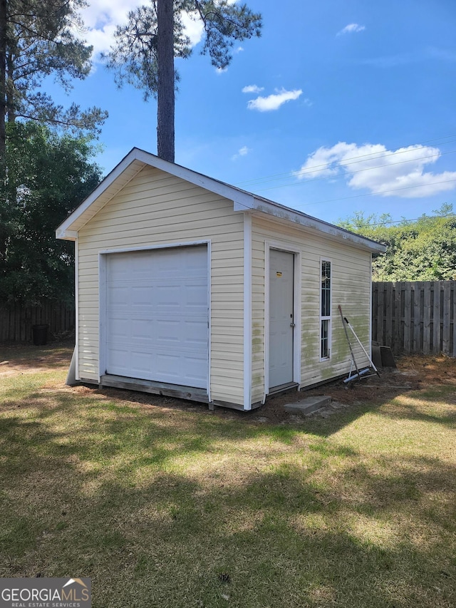 garage featuring fence