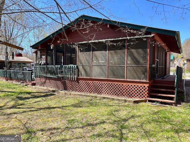 41 Speckled Trout Dr, Cleveland, GA 30528 - back of house with a sunroom, a lawn, and a deck