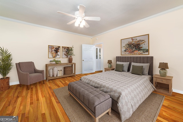 1631 Moody Holw, Hiawassee, GA 30546 - bedroom with a ceiling fan, baseboards, ornamental molding, and light wood-style floors