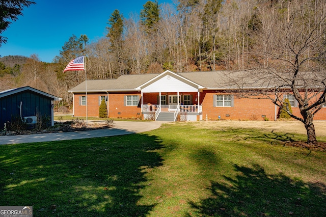 1631 Moody Holw, Hiawassee, GA 30546 - back of property with a porch, brick siding, a yard, and crawl space