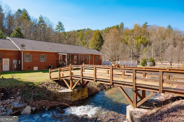 1631 Moody Holw, Hiawassee, GA 30546 - rear view of house with a wooden deck, a yard, and brick siding