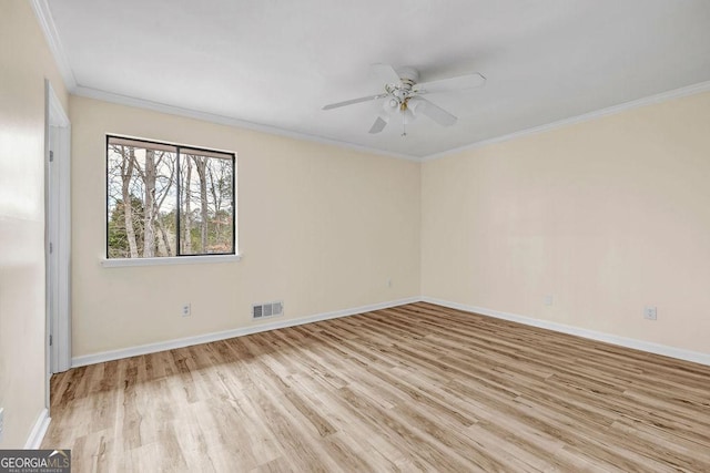 8443 Park Ridge Ln, Riverdale, GA 30274 - empty room with crown molding, a ceiling fan, wood finished floors, baseboards, and visible vents