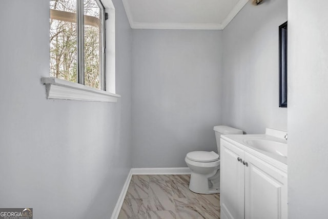 8443 Park Ridge Ln, Riverdale, GA 30274 - half bath featuring vanity, toilet, ornamental molding, baseboards, and marble finish floor