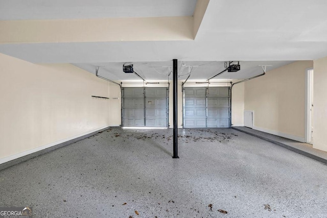 8443 Park Ridge Ln, Riverdale, GA 30274 - garage with baseboards and a garage door opener